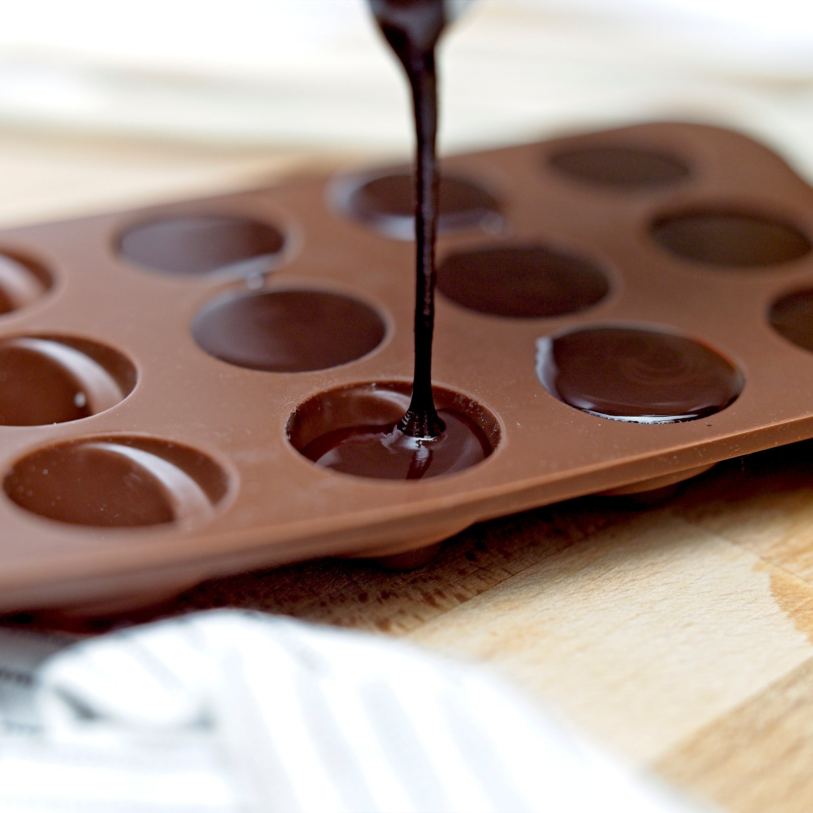 poring raw chocolate into a mould